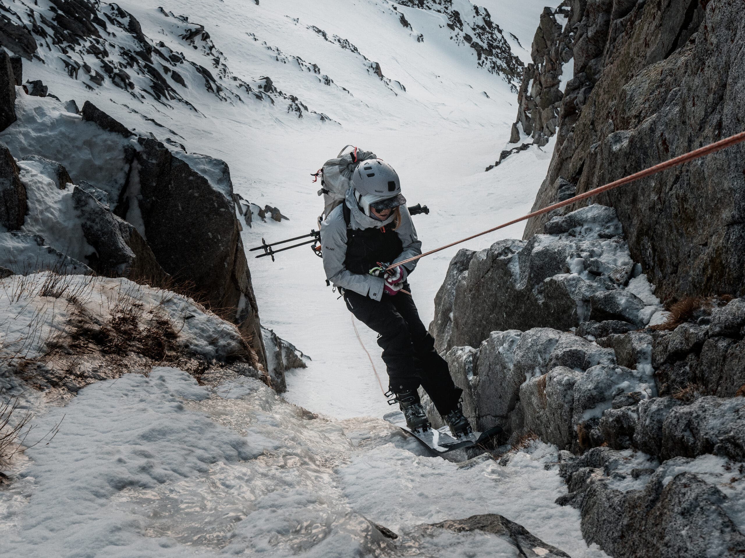 Mali Noyes rappels into a ski line
