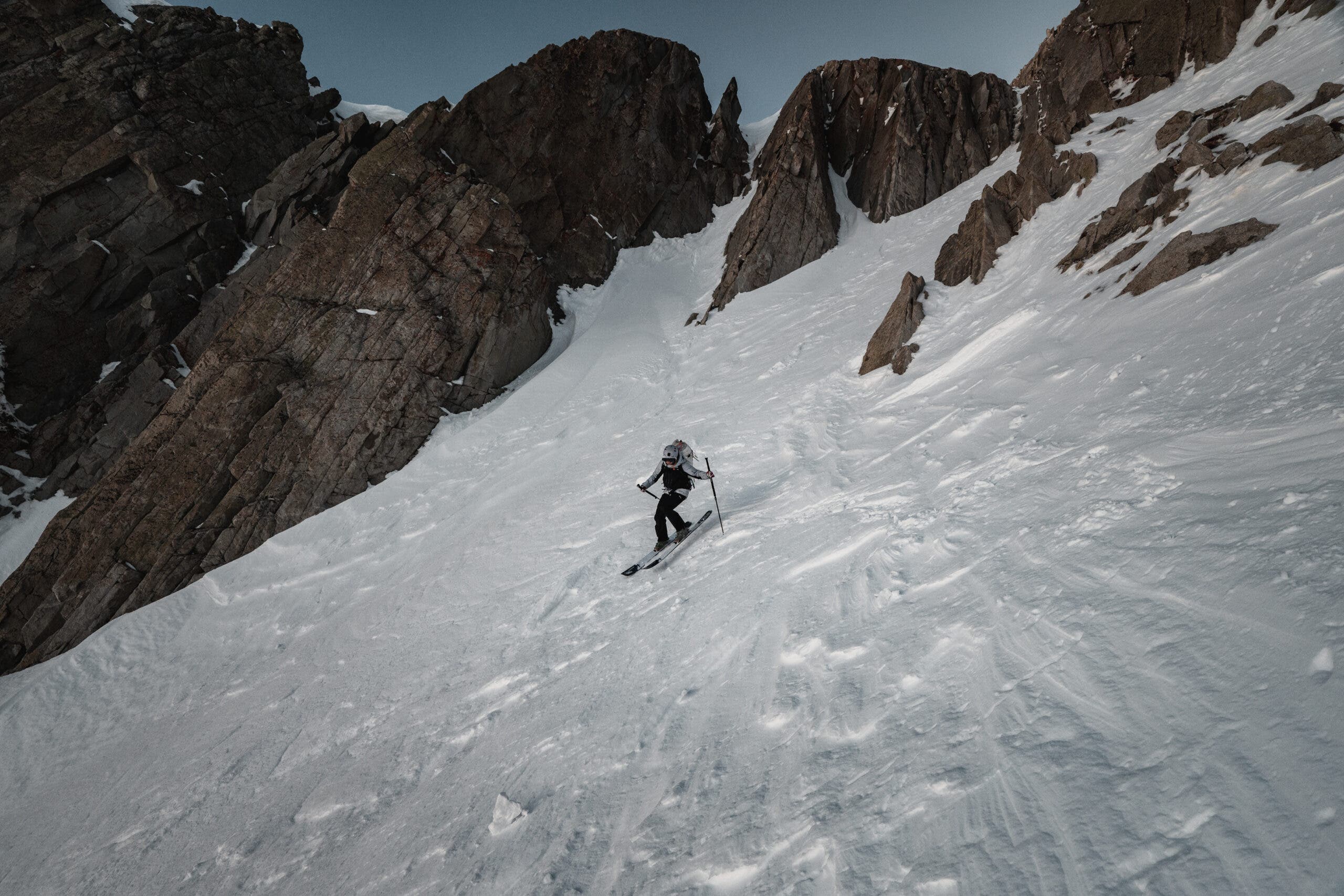 A skier skiing steeps