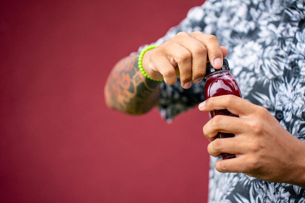 Beetroot juice on a purple background