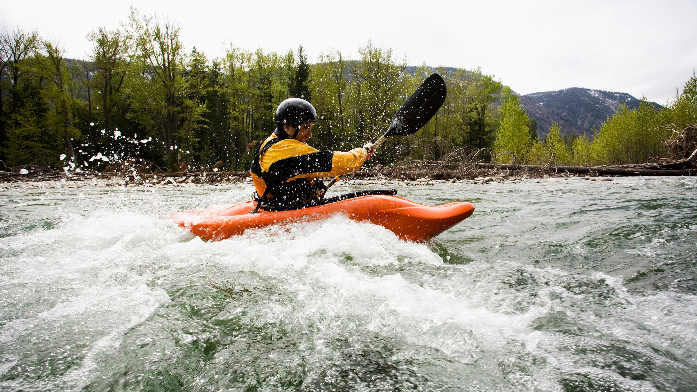 A kayaker plays in a hole on the Methow River, near Mazama, Washington and North Cascade National Park