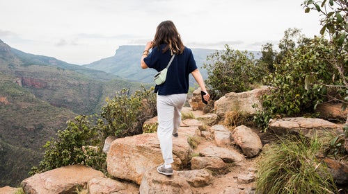 Young tourist exploring The Three Rondavels, Mpumalanga, South Africa while wearing sweat pants