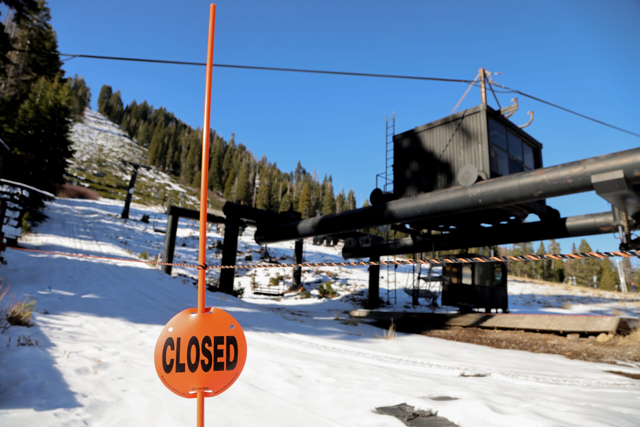 a closed sign in front of Homewood's chairlift