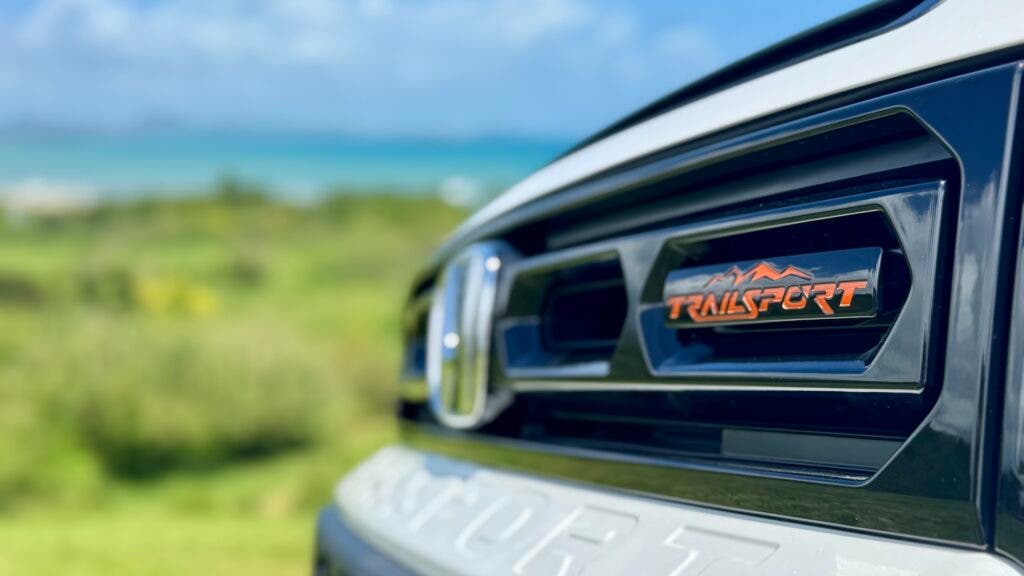 close-up of the grille of a a white 2026 Honda Trailsport Passport