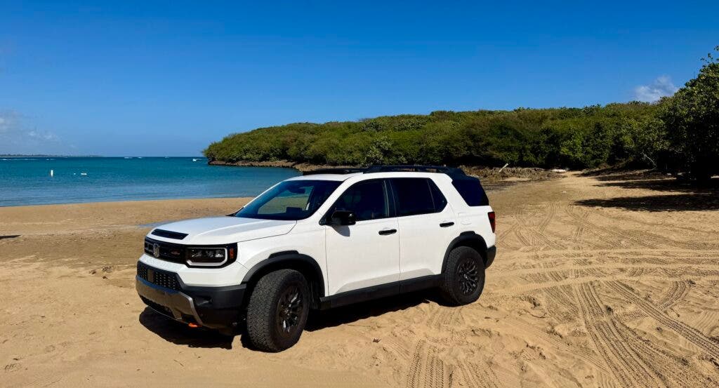 a white 2026 Honda Trailsport Passport on the beach in Puerto Rico, where we took it as part of our review
