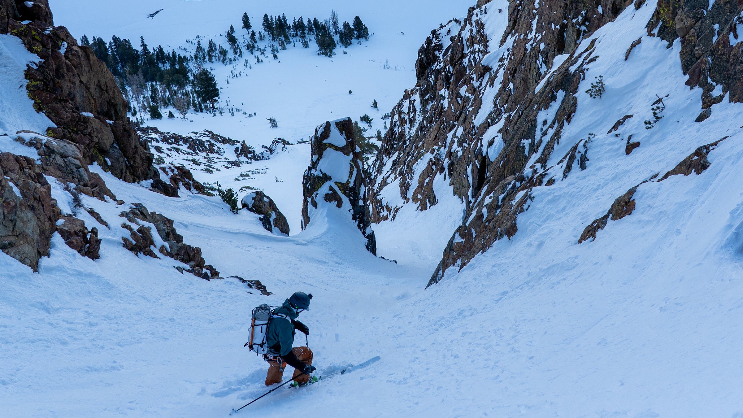 A skier on a WNDR Alpine Intention 108 in a couloir