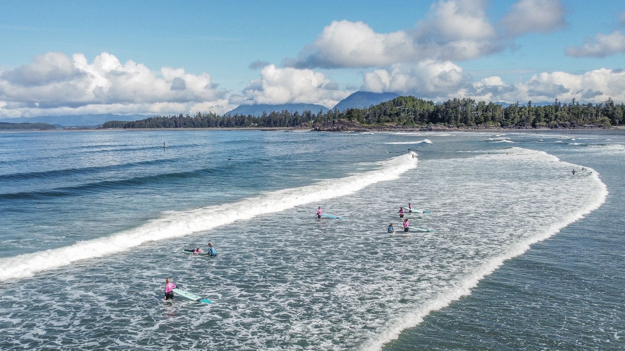 Walking through surf in Tofino