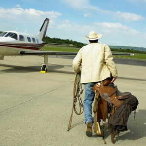 Cowboy walking to the plane