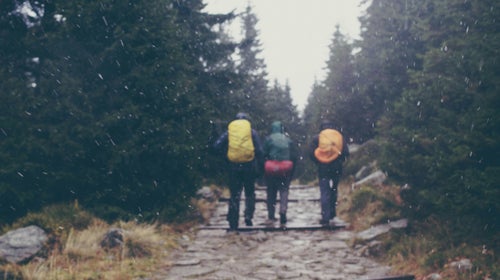 friends hiking in snow