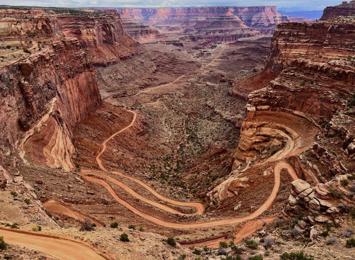 A road switchbacking down a cliffside