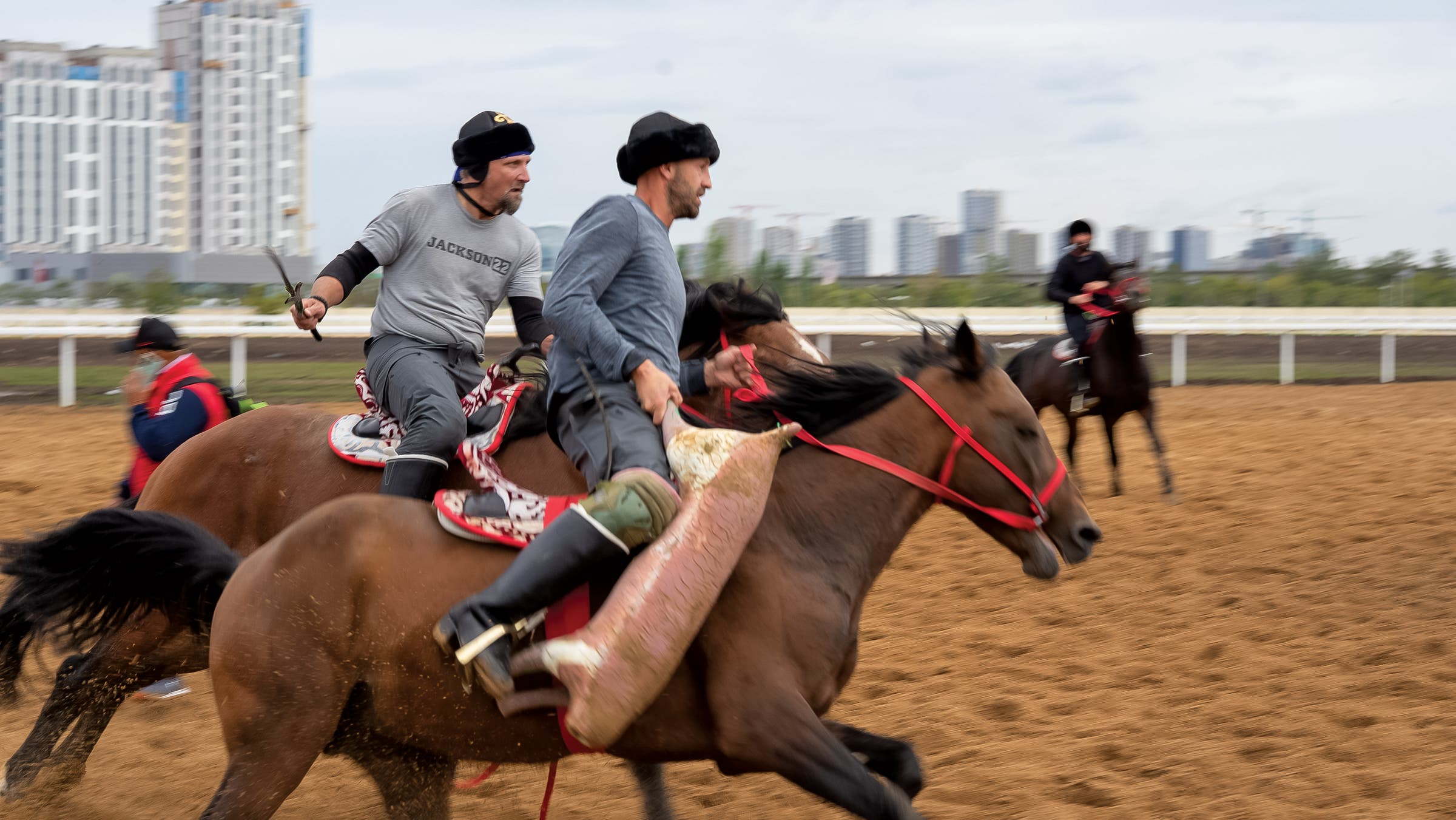 U.S. team cocaptains Scott Zimmerman, left, and Ladd Howell, right, on the practice field in Astana.