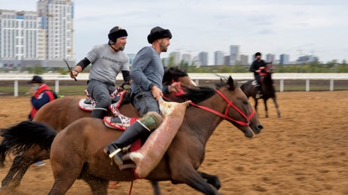 U.S. team cocaptains Scott Zimmerman, left, and Ladd Howell, right, on the practice field in Astana.