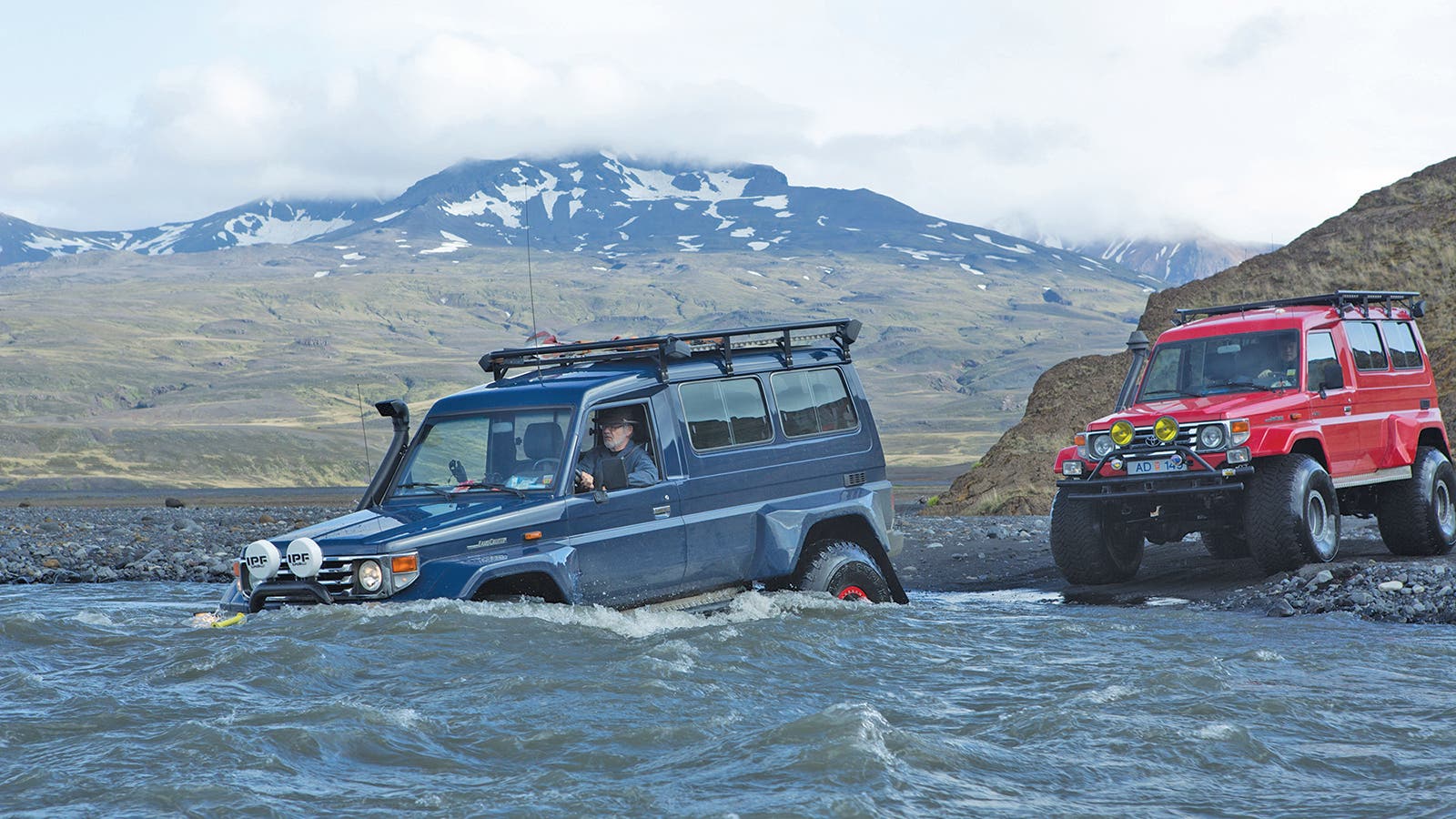 4x4s crossing a river in Iceland