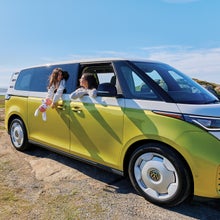 kids driving in the VW Buzz van