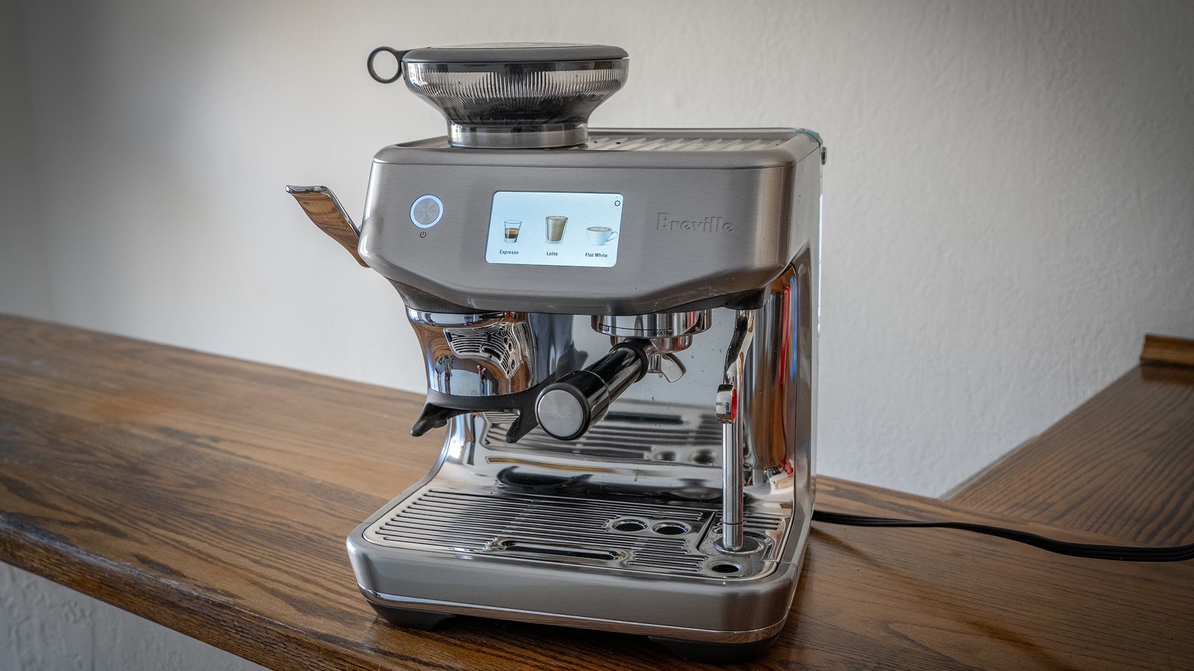 Barista Touch Impress Espresso Machine on wooden countertop