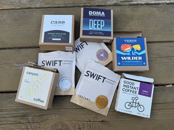 Closeup of instant coffee packs on picnic table