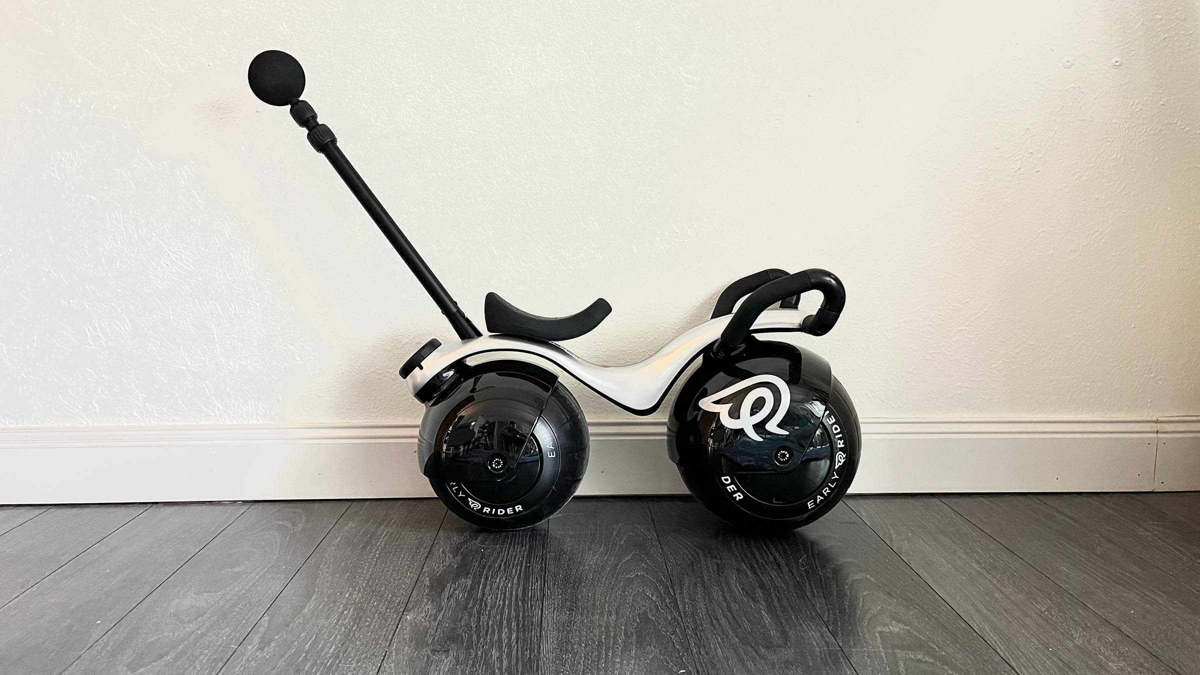 Early Rider Super Velio toddler bike against white wall