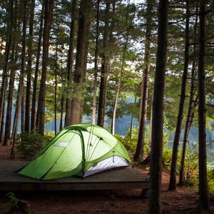 Lighted tent in the woods