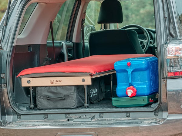 Closeup of Hele Box Solo Car Camping Platform in the back of an SUV with car camping gear
