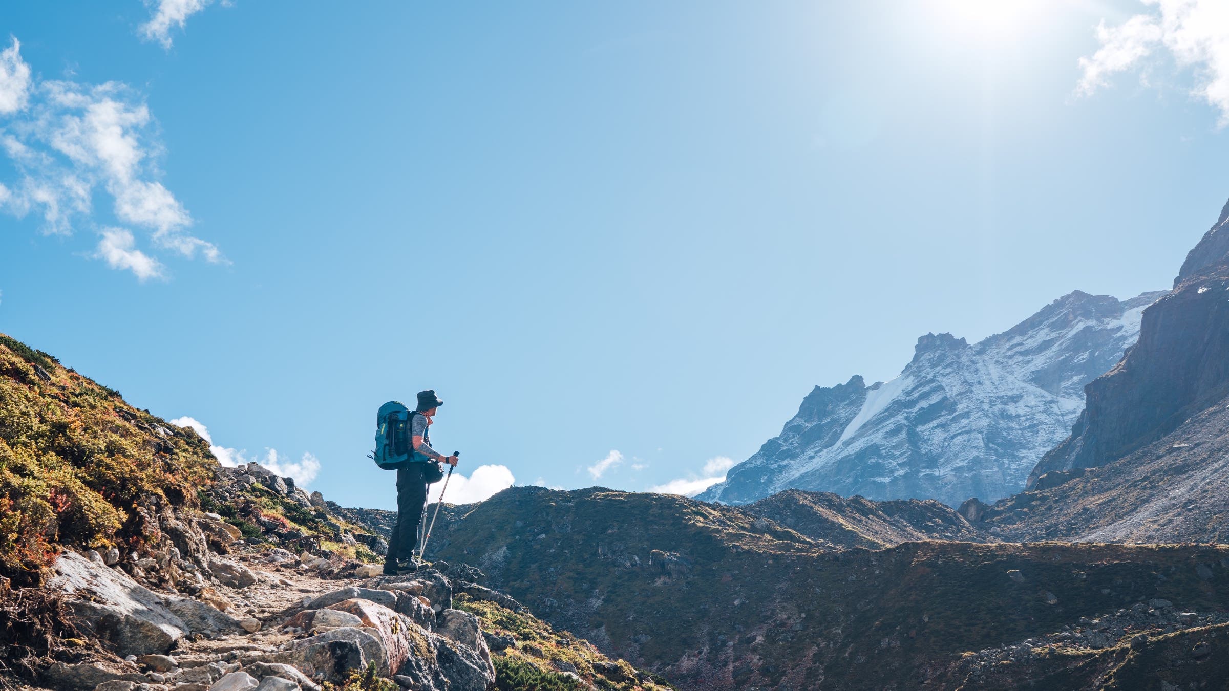 Hiker takes in view of mountains