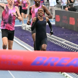 Faith Kipyegon running hard toward the finish line during her Breaking4 mile attempt in Paris.