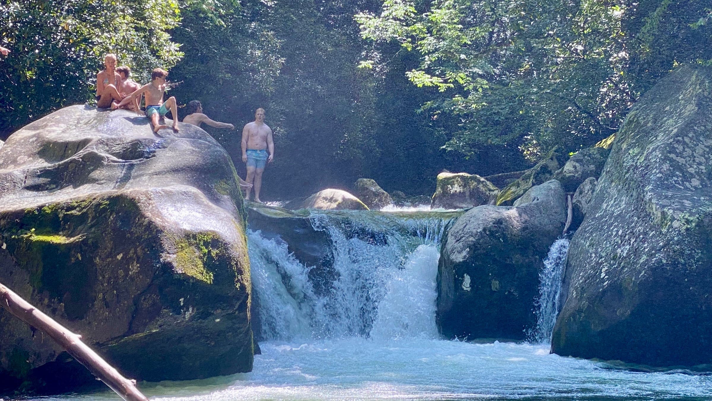 Kids on top of waterfall