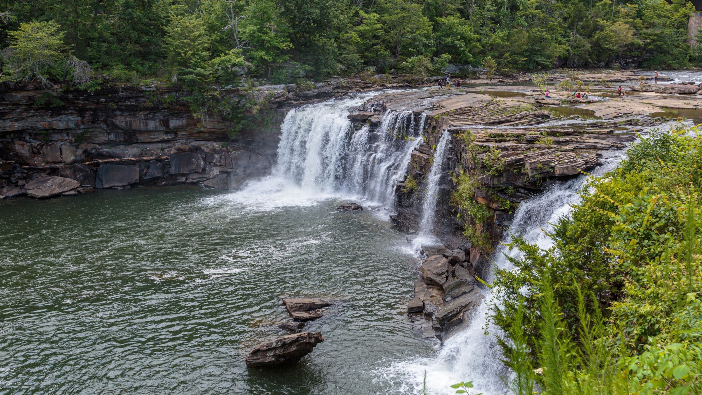 Kids playing near waterfall