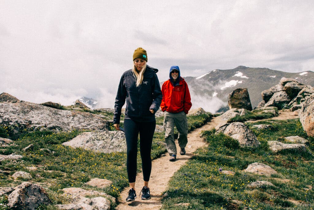 father and daughter hiking in the mountains