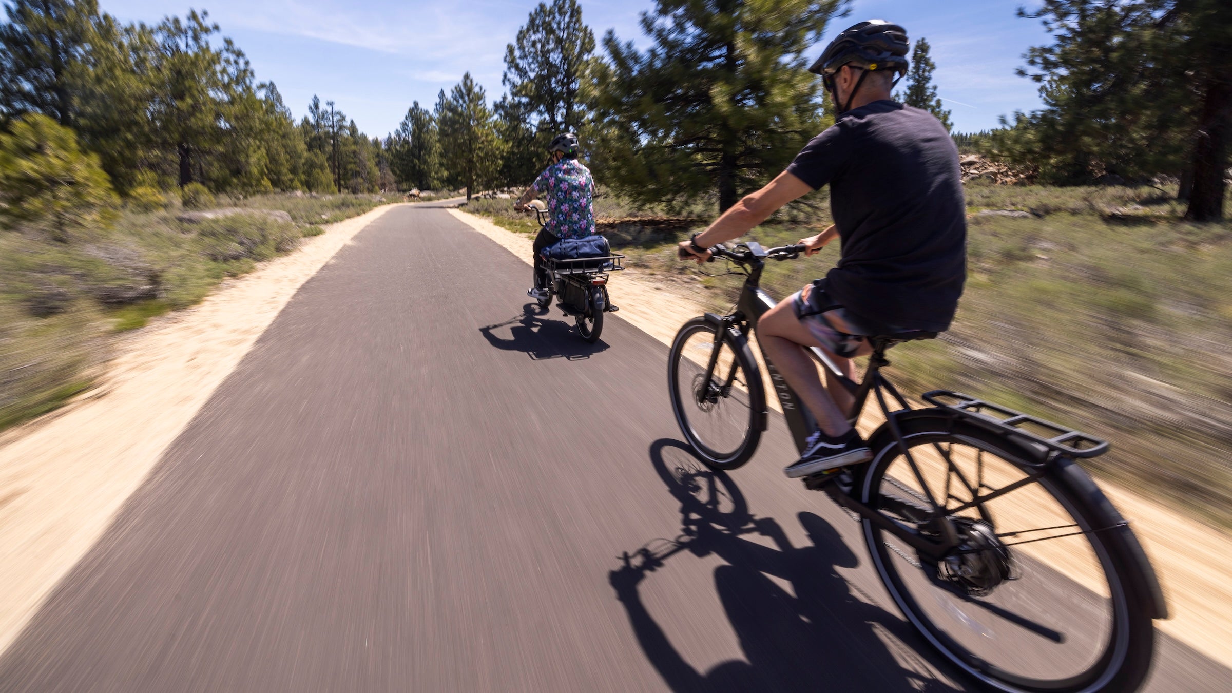 Roy Tuscany (left) and Alex Duff ride along California's Truckee River. 