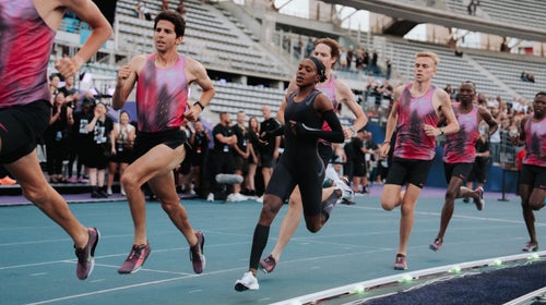 Faith Kipyegon running hard toward the finish line during her Breaking4 mile attempt in Paris.
