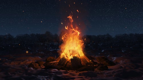 campfire on beach at night