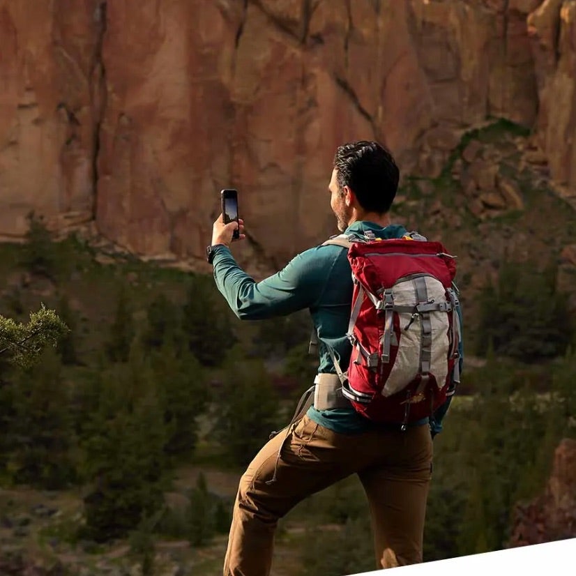 man using garmin on a hike