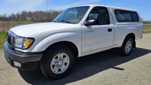 white Tacoma with utility cap