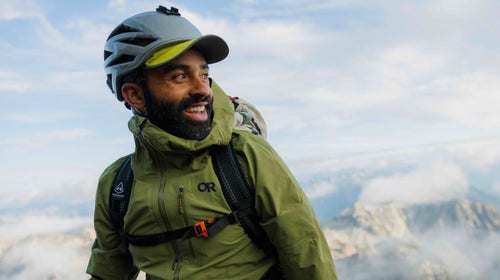 man hiking in outdoor gear