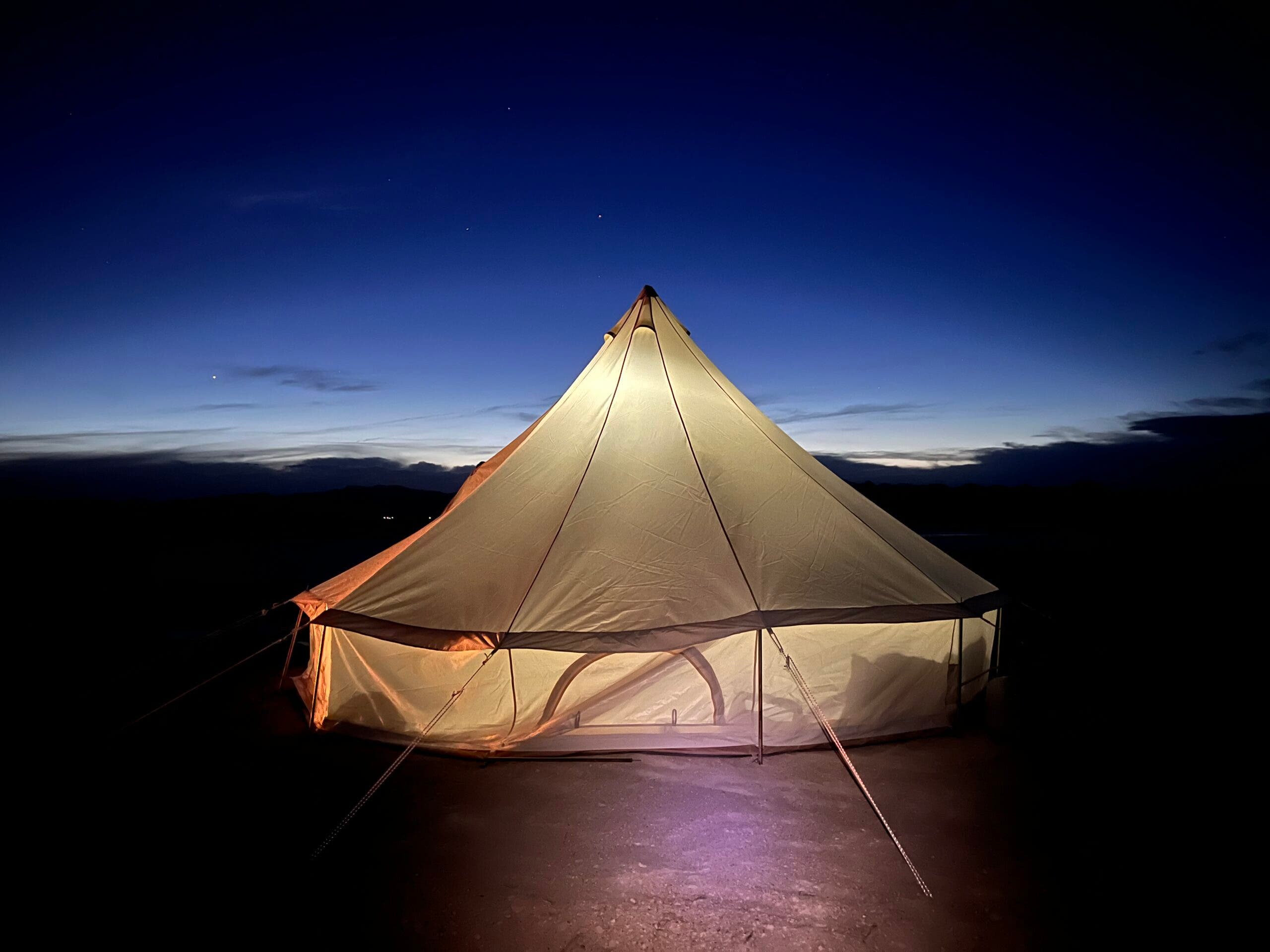 a tent illuminated at night