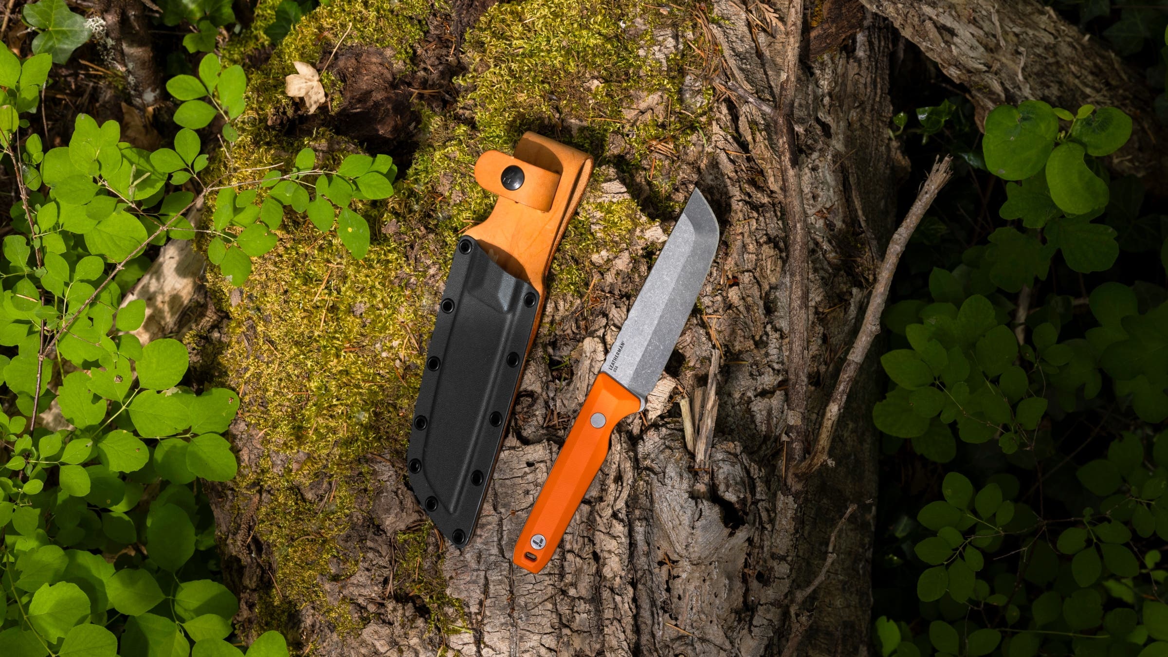 A Leatherman knife on a log
