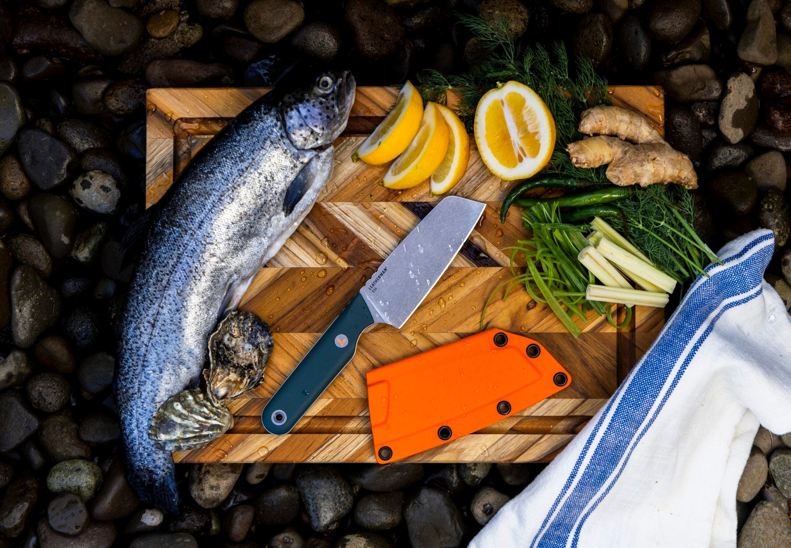 A Leatherman knife on a cutting board