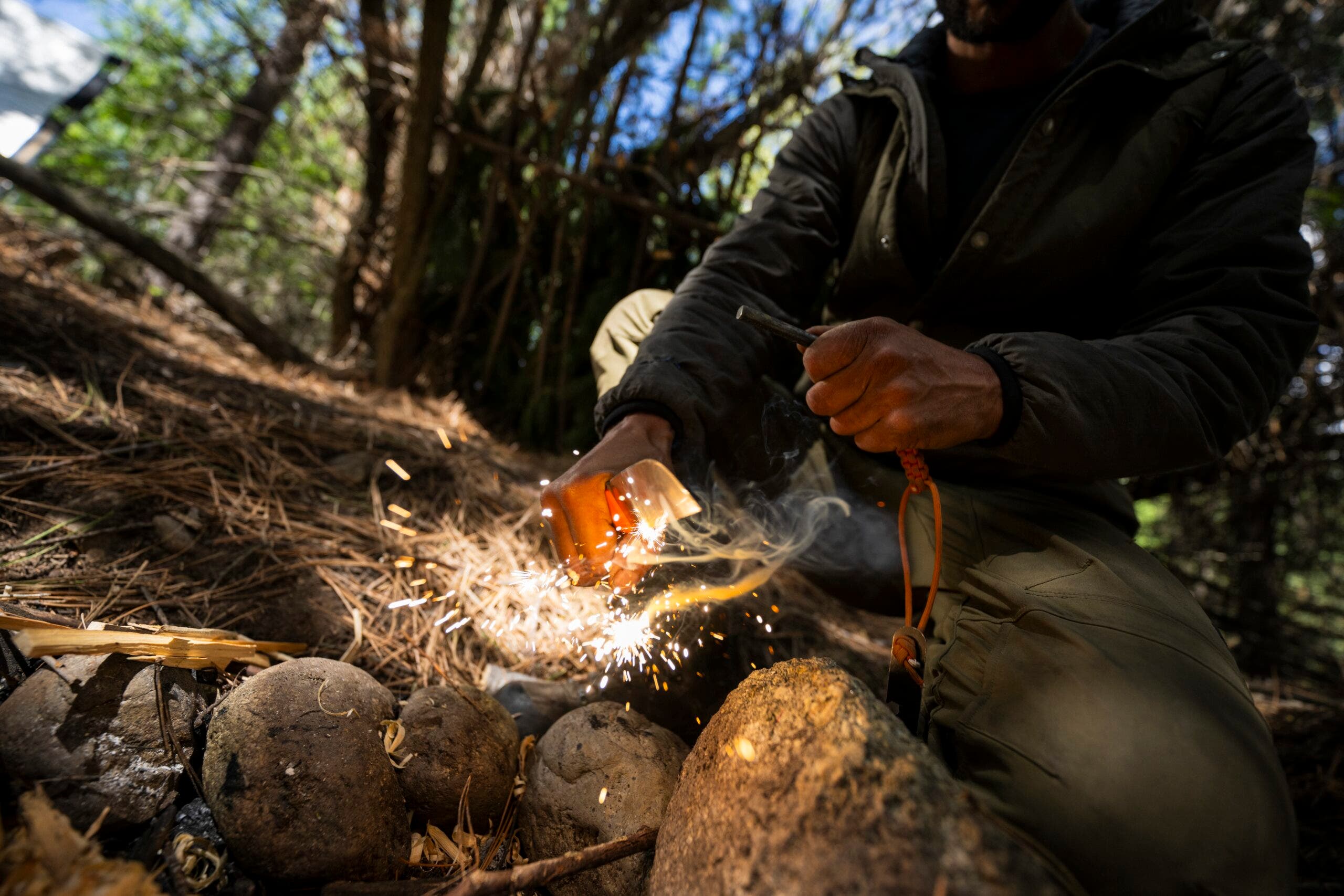 A Leatherman knife striking flint