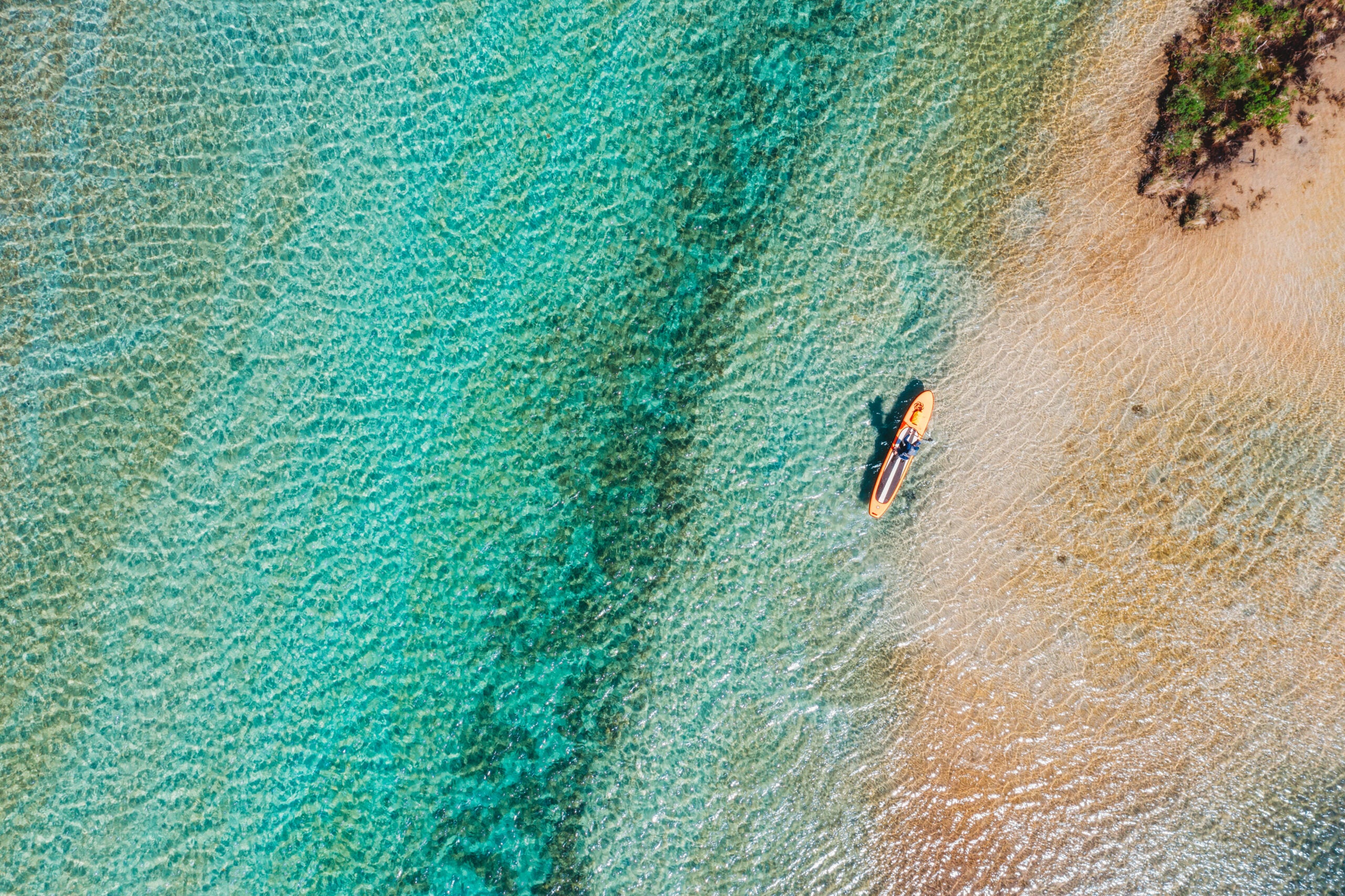 Torch Lake, Michigan Noted for its exceptional beauty; its waters are unusually clear and exhibit a bright turquoise hue, often resembling Caribbean waters.