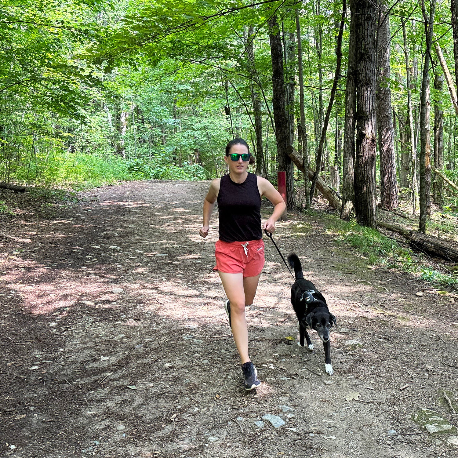 woman and dog on trail with leash for running with your dog