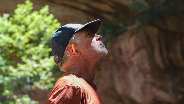 hiker wearing Beats Powerbeats Pro 2 best sport earbud