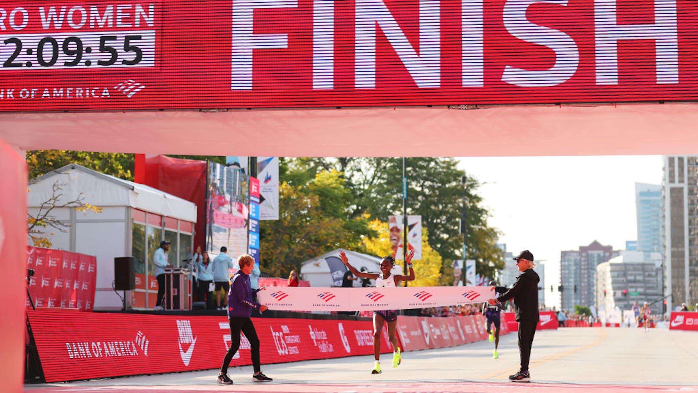 Ruth Chepngetich of Kenya crosses the finish line to win the 2024 Chicago Marathon professional women's division and sets a new world record with a time of 2:09:56 at Grant Park on October 13, 2024 in Chicago, Illinois.