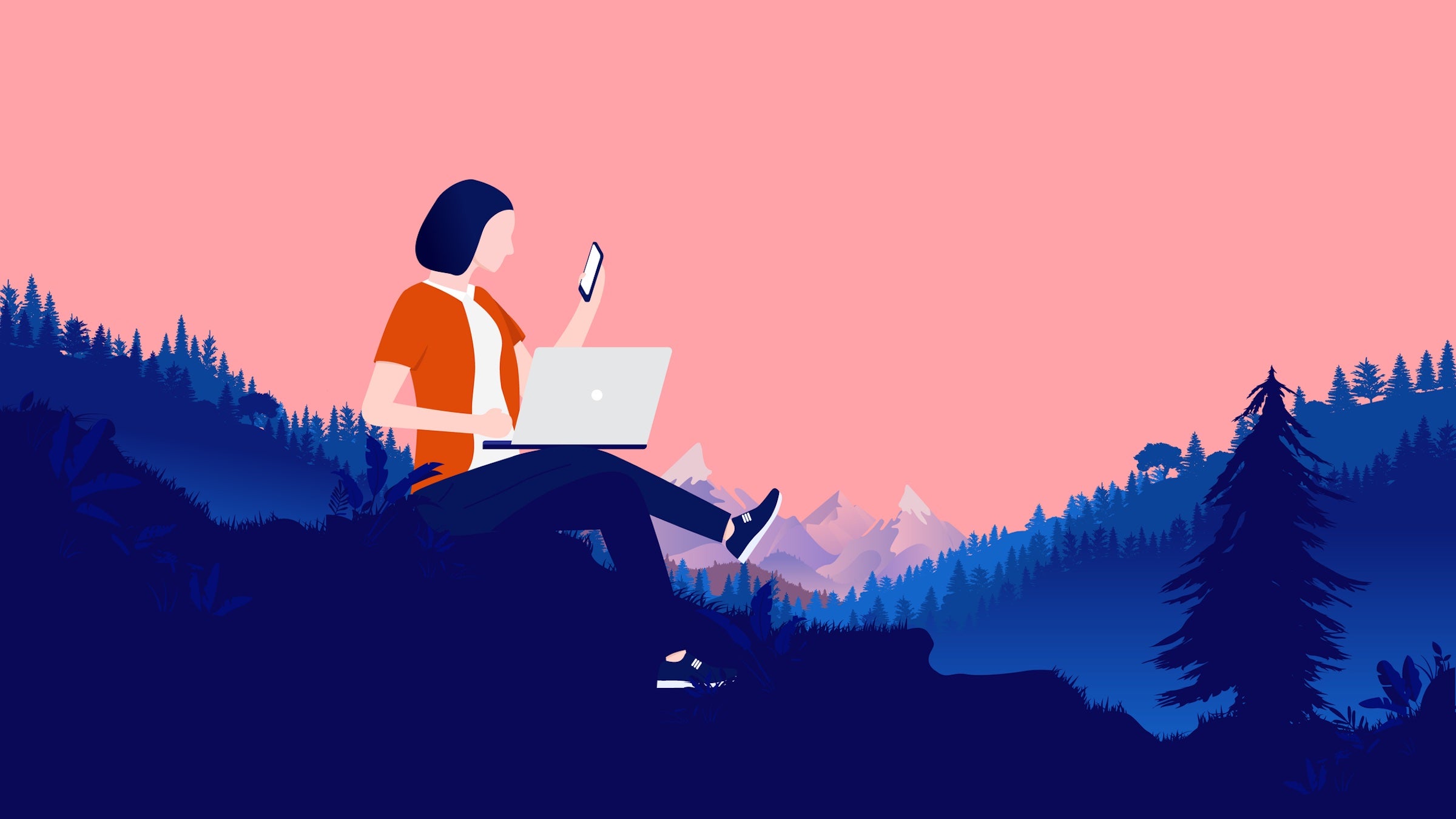 woman doing work with computer outside in mountains