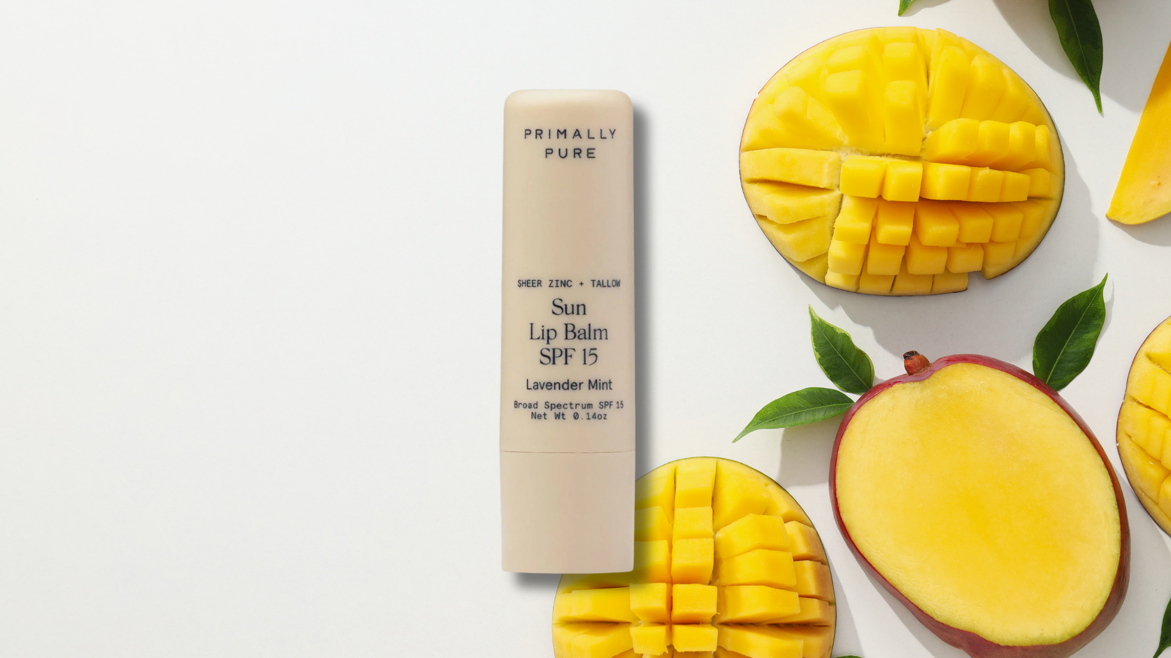 primally pure lip balm spf on mangoes background