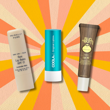 SPF lip balms on sun background