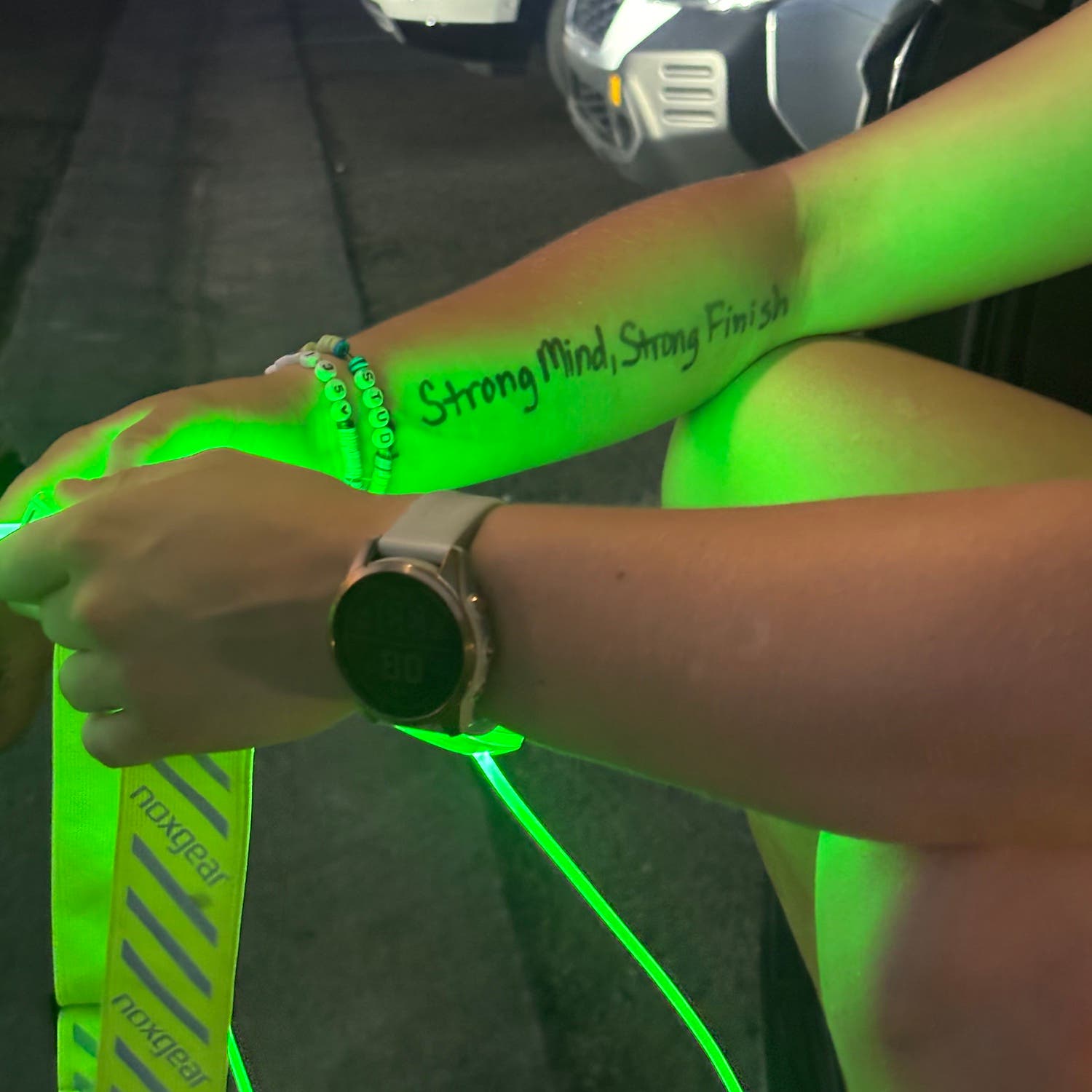 "Strong mind, strong finish" written on arm