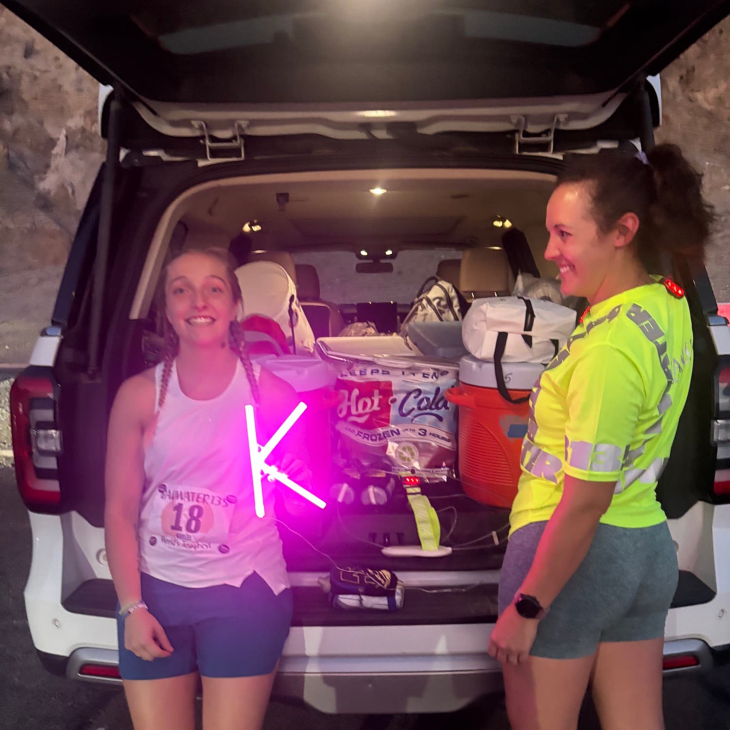 runner with crew member and glowing K