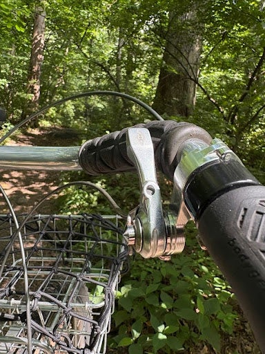 When downshifting with the OM-1, the chain flew right up the cassette with the flick of the lever, and because of the low-normal action, front and rear shifting actions now matched. With the Silver shifters in under-the-bar-thumbie mode, that meant forward to downshift, and back to upshift, on both the front and the rear.