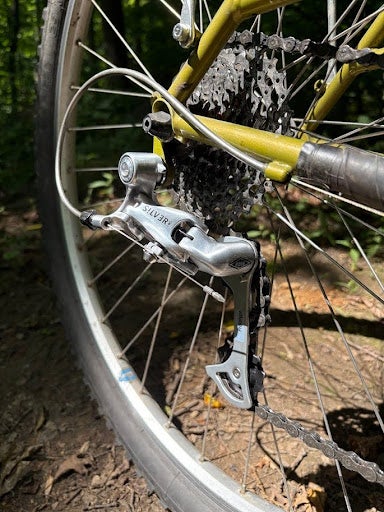 When downshifting with the OM-1, the chain flew right up the cassette with the flick of the lever, and because of the low-normal action, front and rear shifting actions now matched. With the Silver shifters in under-the-bar-thumbie mode, that meant forward to downshift, and back to upshift, on both the front and the rear.