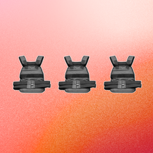 three weighted vests on orange ombre background