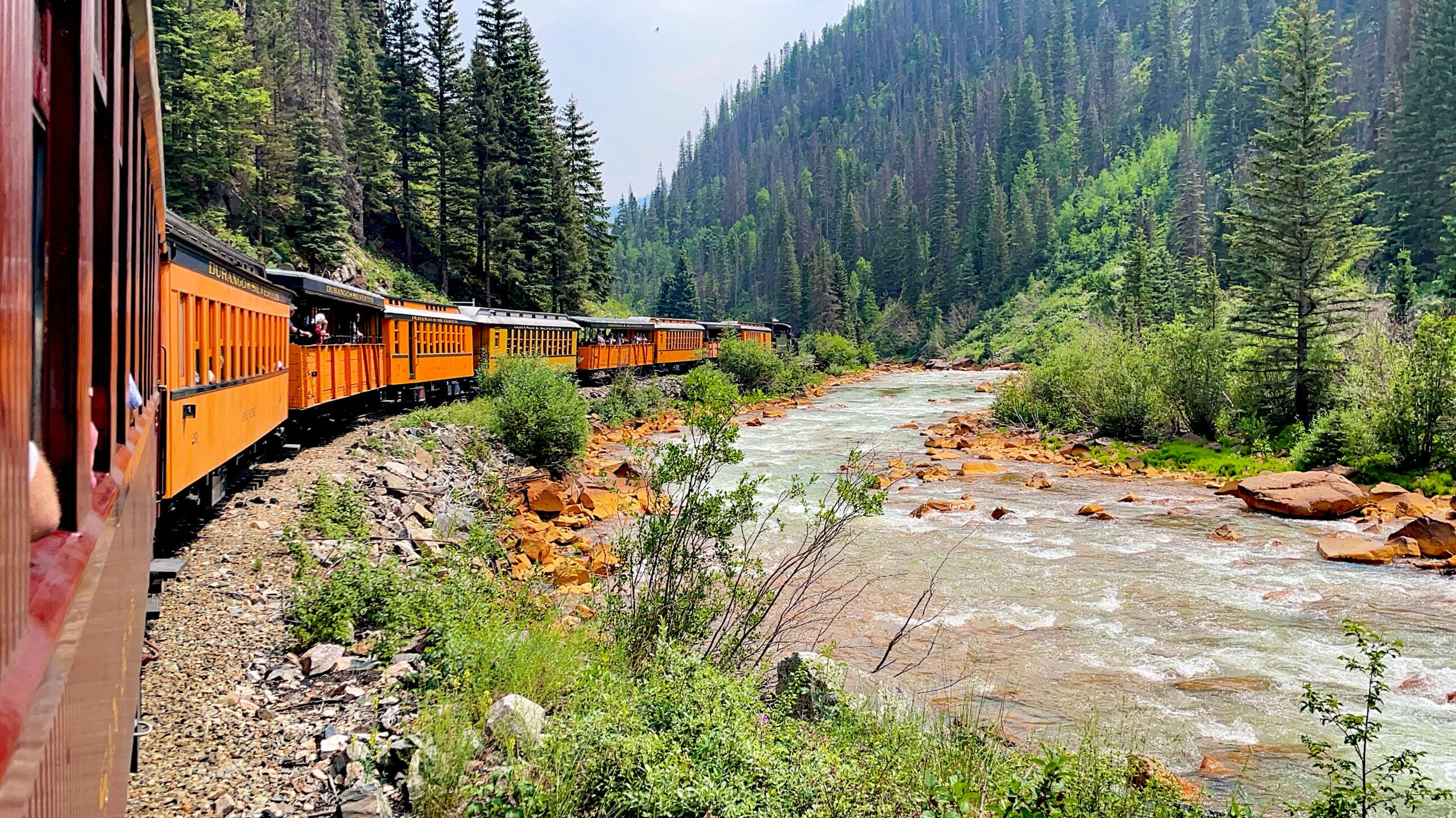 View of the Animas River and the Durango and Silverton Narrow Gauge Railroad train as seen from a passenger’s perspective.